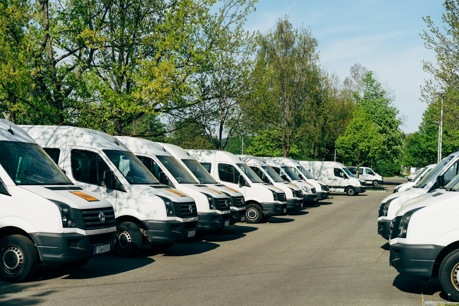 cars parked on parking lot during daytime, trucking liability